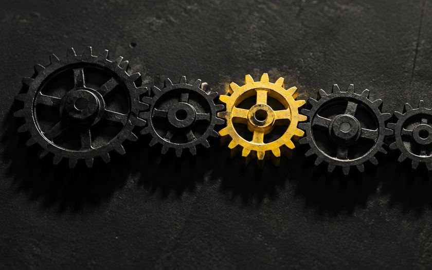 Row of gears with one painted yellow